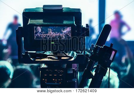 Shooting concert professional camera. View of the video camera viewfinder.