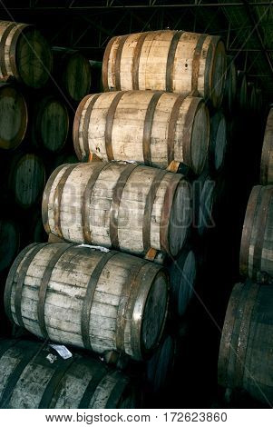 Wine Barrels Stacked In The Old Cellar Of The Winery.