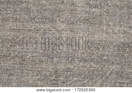 Homespun hemp cloth. Close-up of texture fabric cloth textile background. Homespun hemp fabric material. Homespun hemp canvas. Natural authentic cloth
