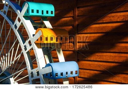 Layout part ferris wheel on a wooden background with free space