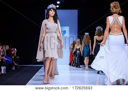 MOSCOW RUSSIA - OCTOBER 19 2016: Model walk runway for WORLD RUSSIAN BEAUTY catwalk at Spring-summer 2017 Moscow Fashion Week. Clothes in national ethnic style.