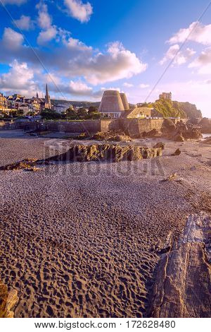 Ilfracombe town. View from Capstone Hill. Clouds in the blue sky. Clear weather. The evening sun. Low tide. North Devon. UK