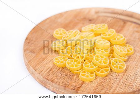 Raw Unboiled Pasta On The Kitchen Cutting Board