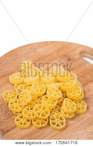 Raw Unboiled Pasta On The Kitchen Cutting Board