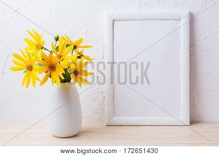 White frame mockup with yellow rosinweed flowers in pitcher. Empty frame mock up for presentation artwork.