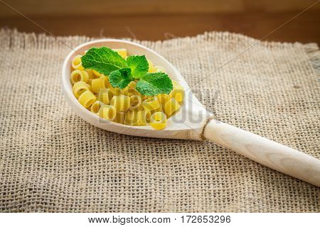 Pasta Rings On Sacking On Wooden Background
