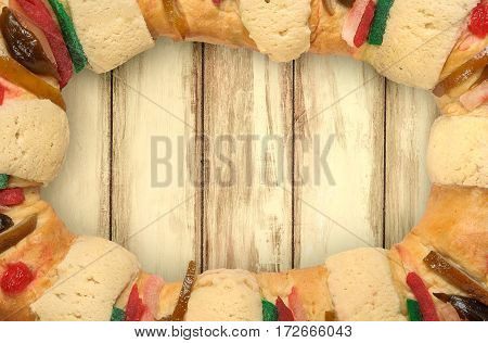 Epiphany cake Kings cake Rosca de reyes with wooden background