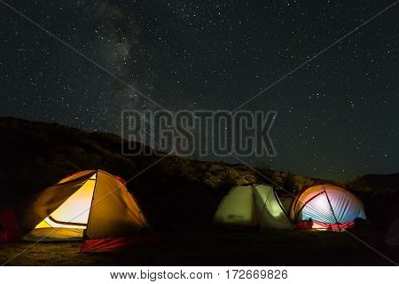 Milky Way in the night sky above the tourist campground. Brookvalley Spokoyny at the foot of outer north-eastern slope of caldera volcano Gorely.