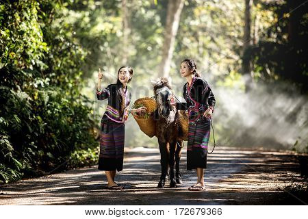 Tribal people living Geum Mugabe in costume wearing a beautiful city in Laos.