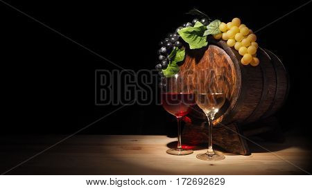 Glass Of Red , White Wine And Barrel On Wooden Table