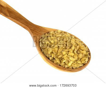 bulgur on a wooden spoon on a white background