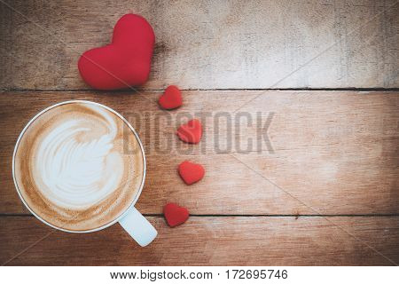 Heart and cup of coffee on wooden background with copy space.Valentines Day background concept Wedding day.Top view vintage tone