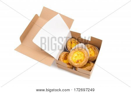 creamy egg tart with sweet curstard in a box isolated on white background