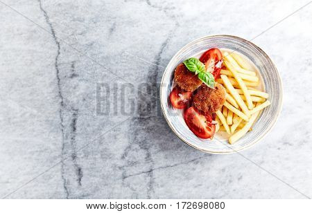 Frikadeller with french fries and tomatoes