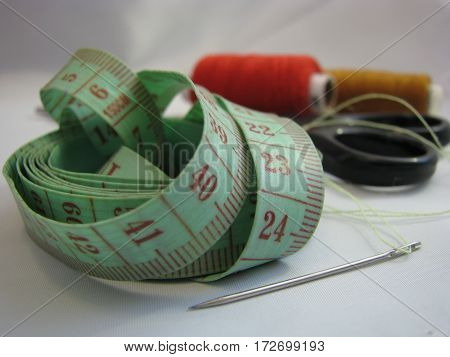workflow sewing colored thread in the home on a white background