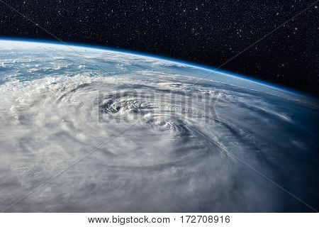 Typhoon over planet Earth - satellite photo. Elements of this image furnished by NASA.