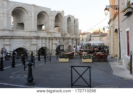 People Walking In Front Of The Amphithater At Arles