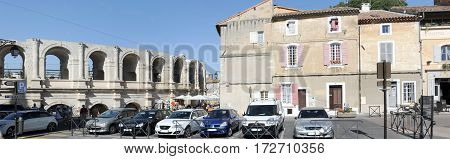 People Walking In Front Of The Amphithater At Arles