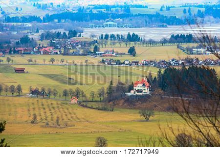 Bavaria landsape aerial view with traditional bavarian village houses and lake in Germany