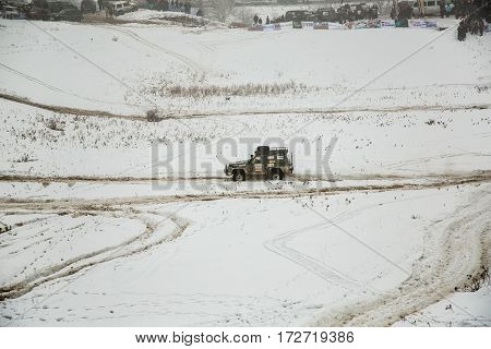 ALMATY KAZAKHSTAN - FEBRUARY 21 2013: Off-road racing on jeeps Car competition ATV. Traditional race 