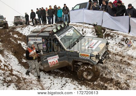 ALMATY KAZAKHSTAN - FEBRUARY 21 2013: Off-road racing on jeeps Car competition ATV. Traditional race 