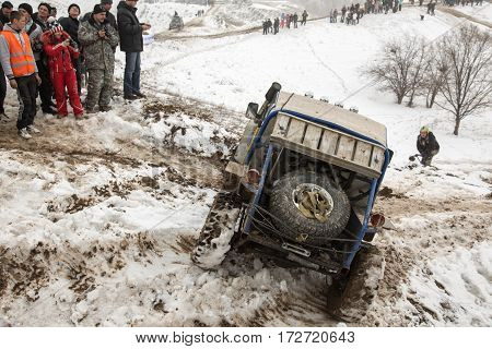 ALMATY KAZAKHSTAN - FEBRUARY 21 2013: Off-road racing on jeeps Car competition ATV. Traditional race 