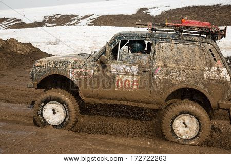 ALMATY KAZAKHSTAN - FEBRUARY 21 2013: Off-road racing on jeeps Car competition ATV. Traditional race 
