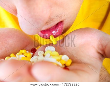 Young Man hold a Pills in the Hands closeup