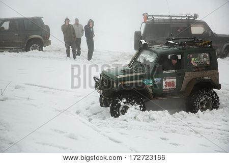 ALMATY KAZAKHSTAN - FEBRUARY 21 2013: Off-road racing on jeeps Car competition ATV. Traditional race 