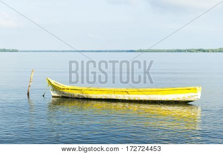 Tied boat on the coast of the sea