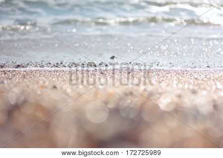 Soft Wave Of Blue Ocean On Sandy Beach. Background. Selective focus.