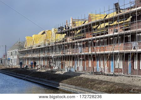 Residential construction site with some workers in Berkel in the Netherlands
