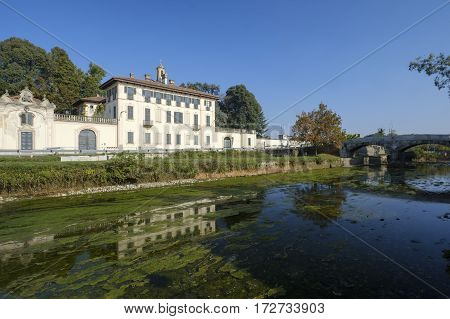 Cassinetta di Lugagnano (Milan Lombardy Italy): facade of the historic Villa Visconti Maineri along the canal known as Naviglio Grande of Turbigo
