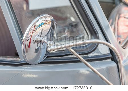 Bangkok Thailand -February 11 2017: Shiny retro wing mirror of classic beetle grey Volkswagen the popular German car manufacture.