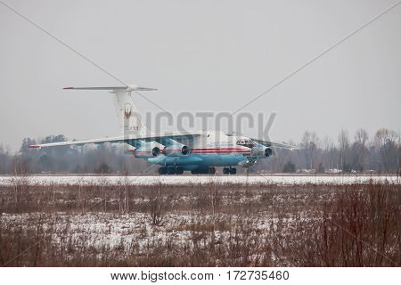 Kiev Region Ukraine - February 1 2011: Ilyushin Il-76 cargo plane taxiing along the runway after landing