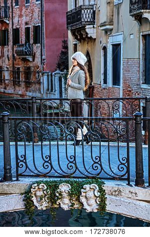 Traveller Woman In Venice, Italy In Winter Enjoying Promenade