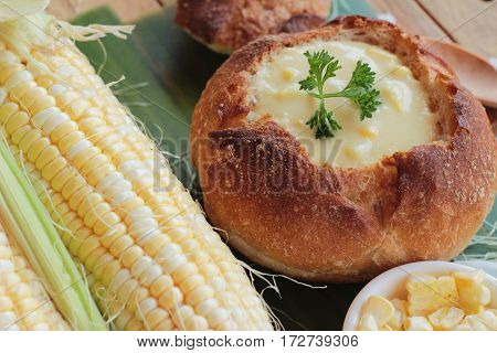 Corn soup in bread bowl with fresh corn