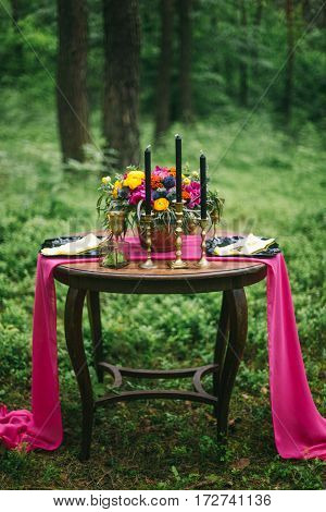 Close Up Of White Vintage Candelabrum On The Wedding Decorated Table In The Forest. Bouquet Of Pink