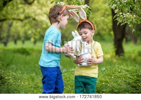 Two Little Kids Boys And Friends In Easter Bunny Ears During Tra