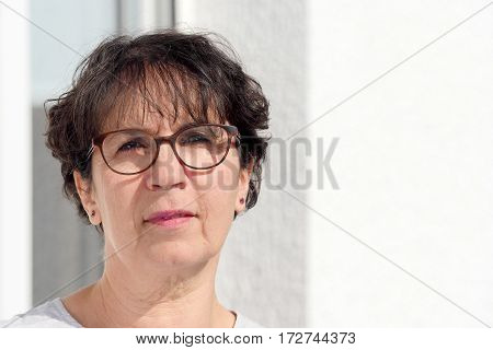portrait of a brunette mature woman with glasses