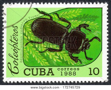 UKRAINE - CIRCA 2017: A stamp printed in Cuba shows beetle Odontotaenius zodiacus. Truqui the series Coleoptera circa 1988