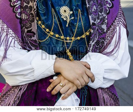QUARTU S.E. ITALY - September 17 2016: Parade of Sardinian costumes and floats for the grape festival in honor of the celebration of St. Helena. - Detail of a traditional Sardinian costumes - Sardinia