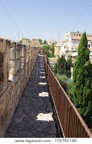 The passage along the wall which surrounds the Old City of Jerusalem. Nobody on the walkway. Israel