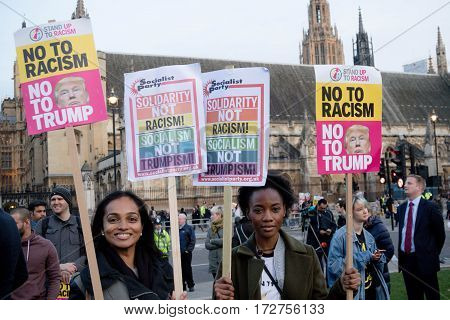 London United Kingdon - Febuary 20th 2017: Protesters gather in Parliment Square to protest the invitation to United States President Donald Trump on a state visit to Great Britain as Parliment debate the visit