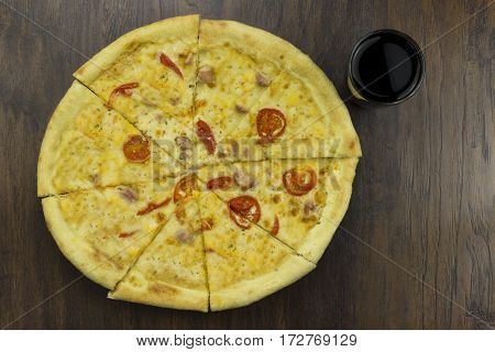large pizza with coca tomatoes and cheese with ham meat chicken with green sauce delicious fast food is bad food is bad food