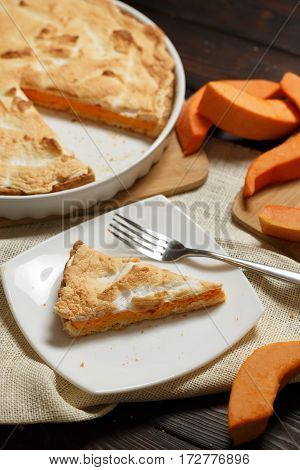 Homemade Pumpkin Pie for Thanksigiving on old wood table