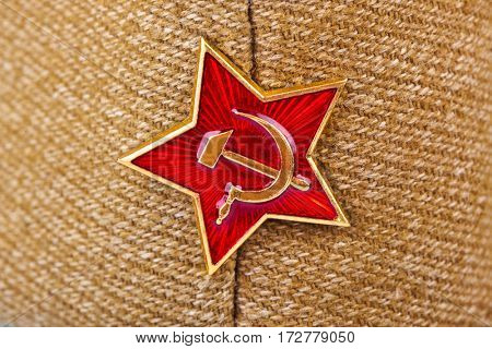 Soviet State Star on forage-cap - russian background