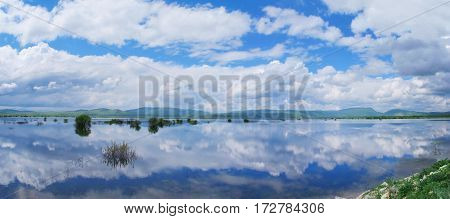 clouds reflection in the beathtaking lake of Bacinska in Croatia