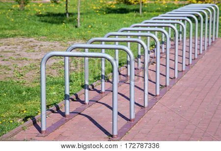 parking space for bicycles outside on sunny summer day
