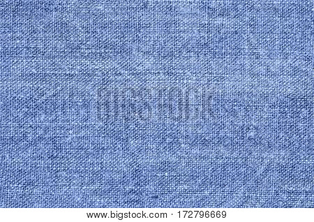 Homespun hemp cloth. Close-up of texture fabric cloth textile background. Homespun hemp fabric material. Homespun hemp canvas. Natural authentic cloth. Blue color